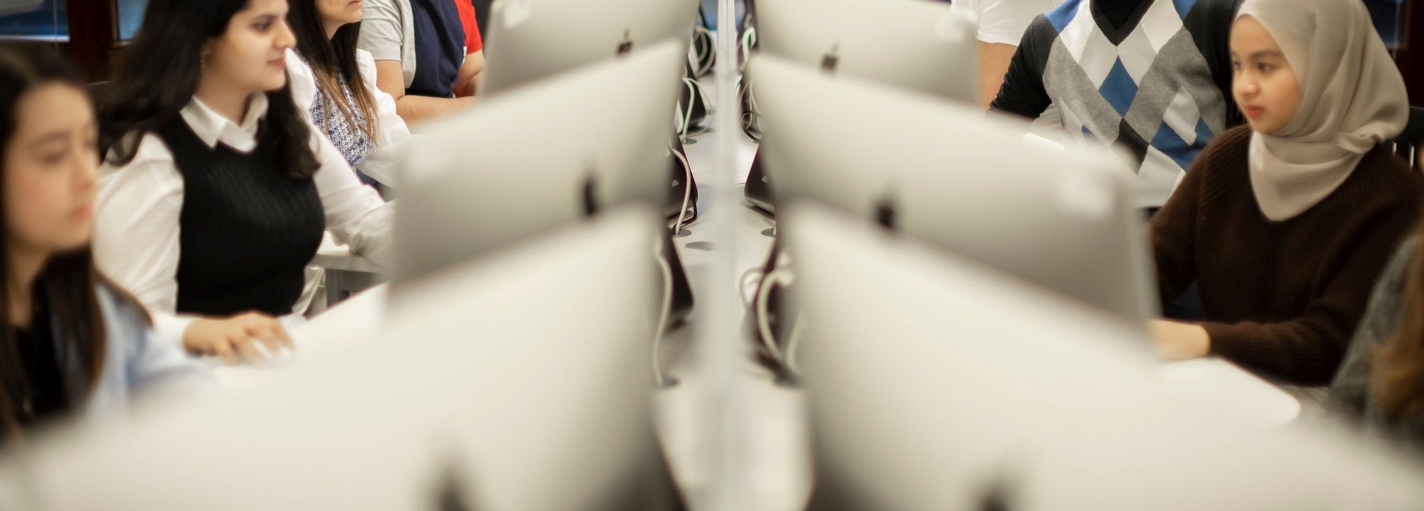 People sitting round a table learning